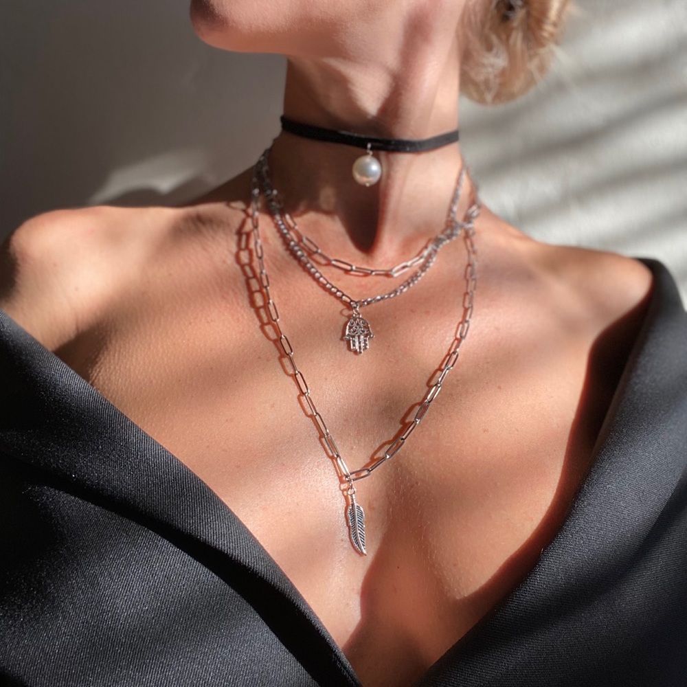 Multi-layered choker necklace. Feather, hamsa, pearl pendant